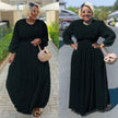 Black maxi dress with cinched waist and puff sleeves, long swing silhouette