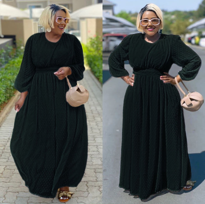 Black maxi dress with cinched waist and puff sleeves, long swing silhouette