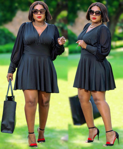 V-neck flared skater dress, long sleeves, dark solid fabric, pleated skirt