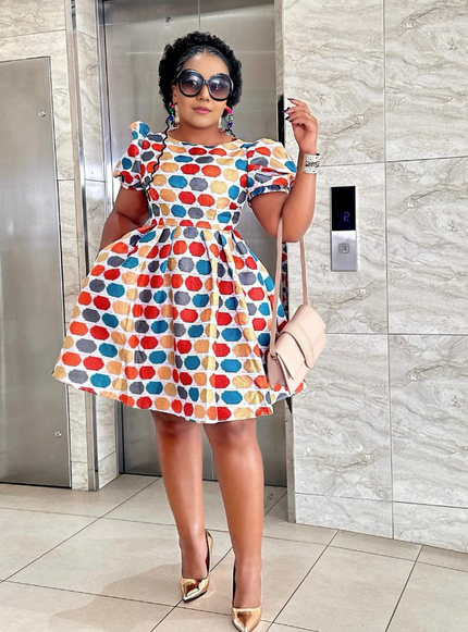 Multicolor polka dot mini dress with puff sleeves and flared skirt
