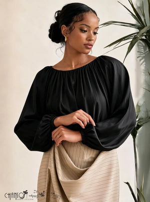 Black gathered neckline blouse with balloon sleeves and elastic cuffs, solid fabric