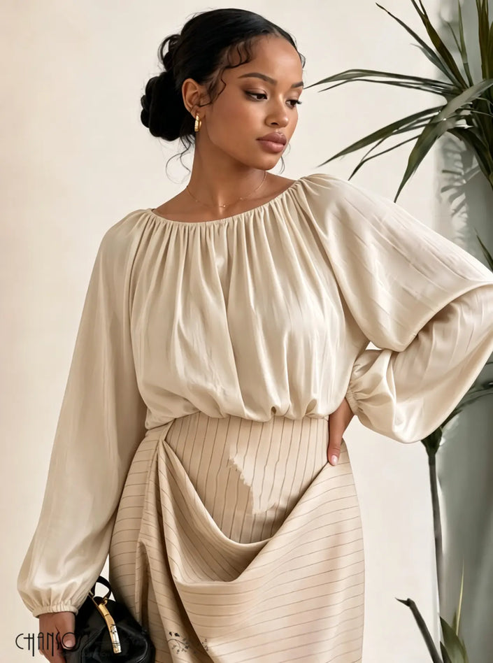 Beige gathered neckline blouse with balloon sleeves and elastic cuffs, solid fabric