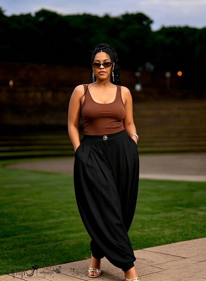 Black harem pleated trousers with metal waist button and side pockets