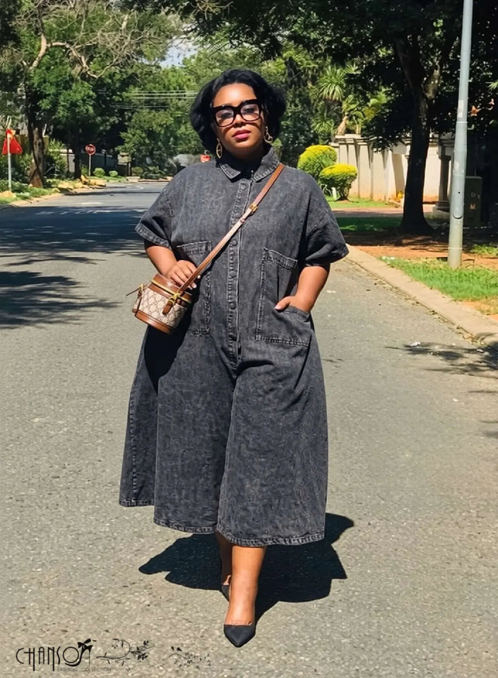 Denim jumpsuit with collared neckline, front pocket detail, relaxed wide legs