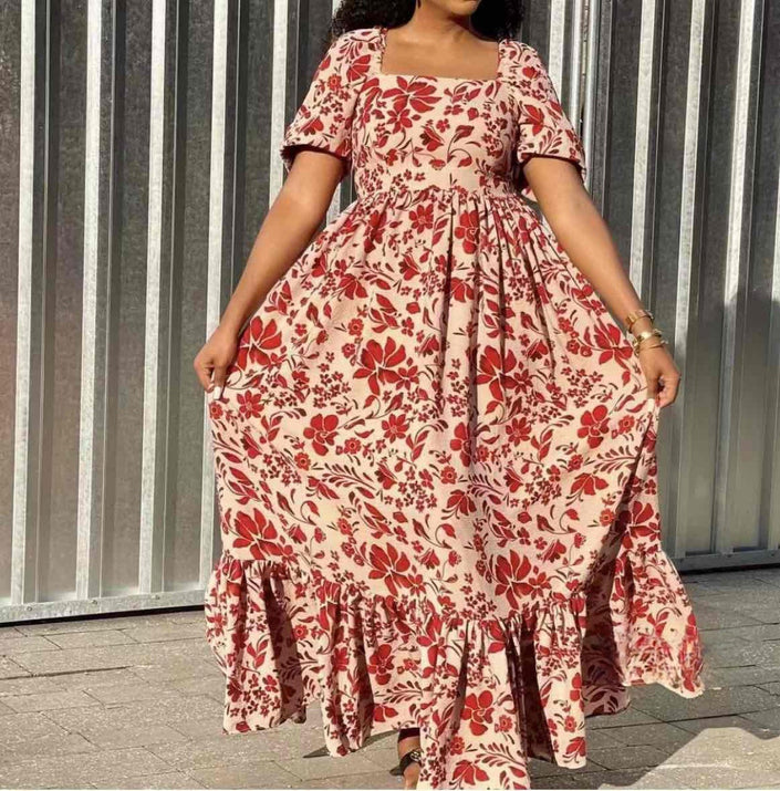 Floral maxi dress with gathered waist, short sleeves, red and cream leaf pattern