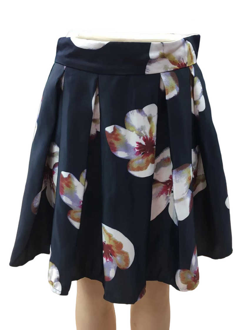 Pleated A-line floral skirt with dark navy base and large multicolor flower prints