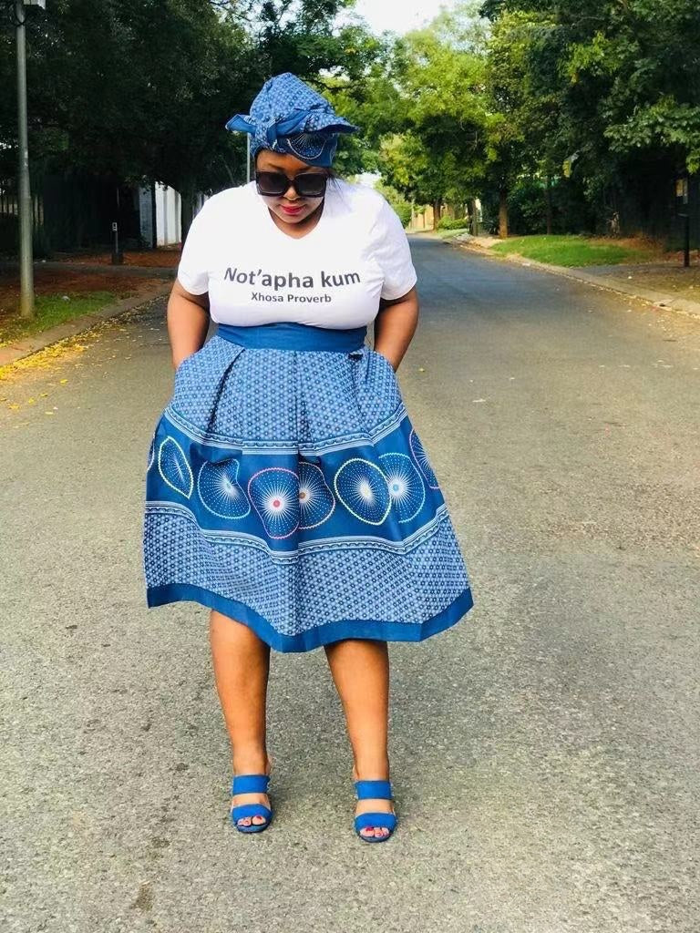Blue A-line skirt with circular African print panels and flared hem