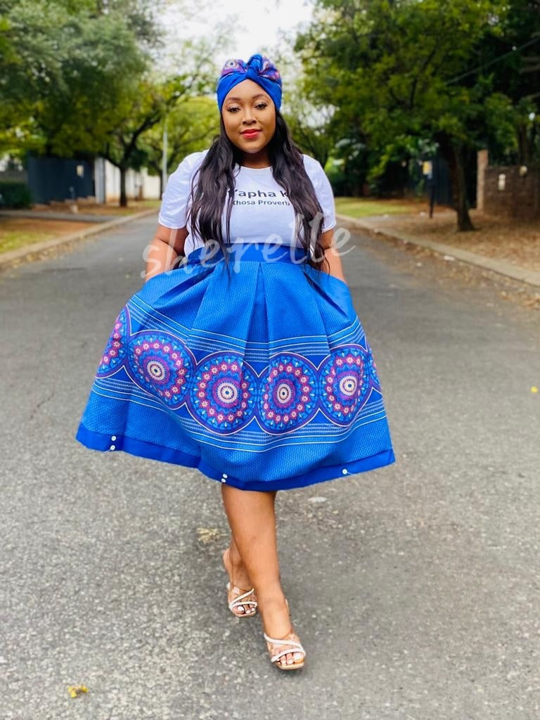 Blue geometric print midi skirt with circular motif flare hem