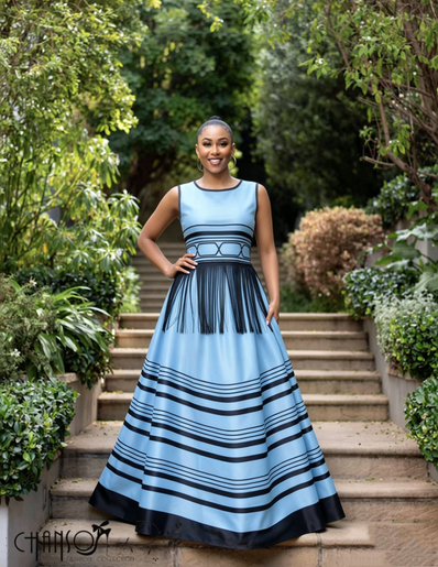 Blue maxi dress with high neckline and striped geometric print, sleeveless