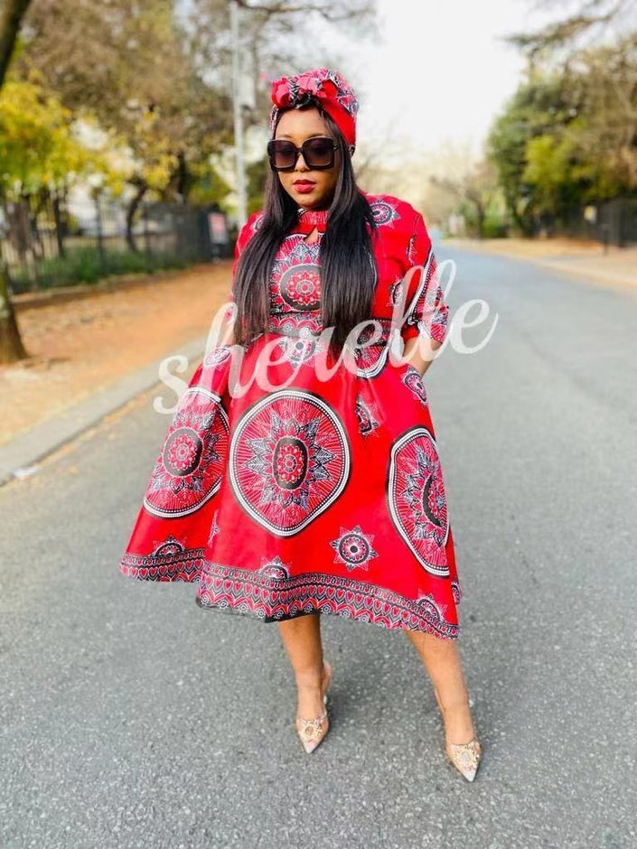 African print dress with matching headwrap, red with white circular motifs