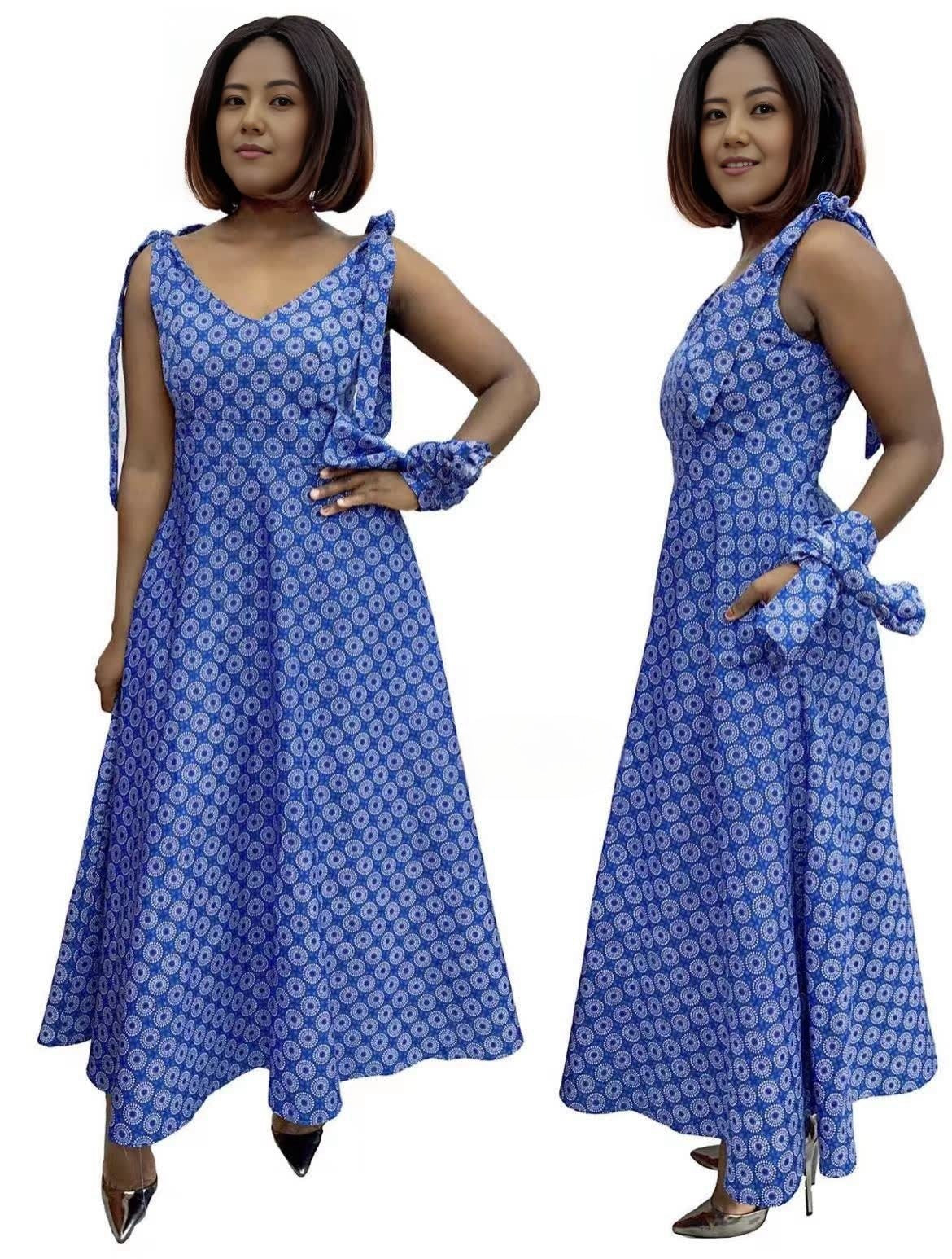 Blue patterned A-line V-neck dress with adjustable straps, high-low hem