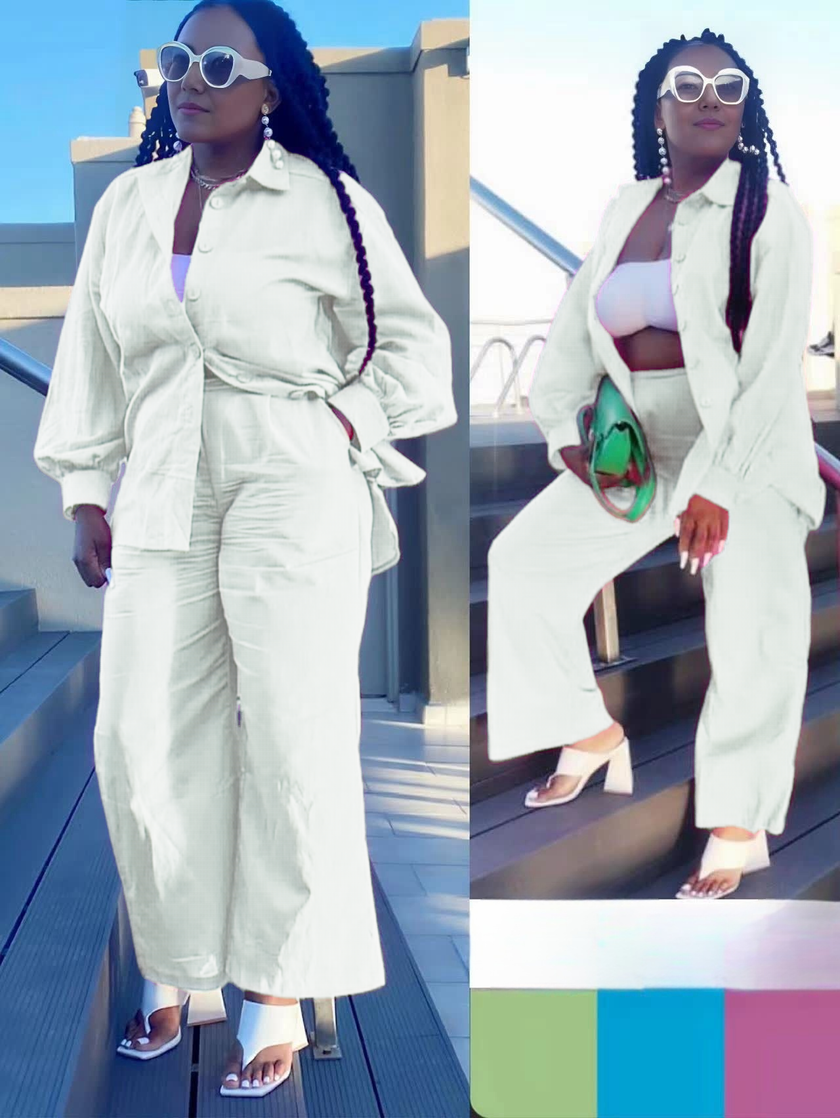 White loose shirt and straight-leg pants twin set, long sleeves, belted waist.