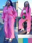 Pink loose shirt and straight-leg pants twin set, long sleeves, belted waist.