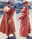 Belted V-neck puff-sleeve dress in rust patterned fabric, flared skirt