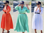 Orange-red midi shirt dress with long sleeves, collar, and waist belt