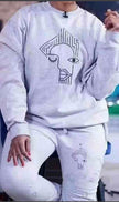 Light gray sweatshirt with abstract face graphic print
