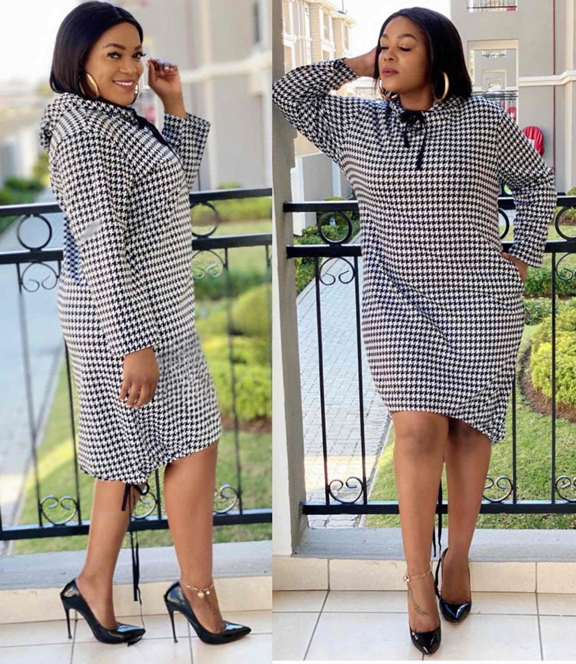 Houndstooth midi dress with tie neck and long sleeves, black-and-white.