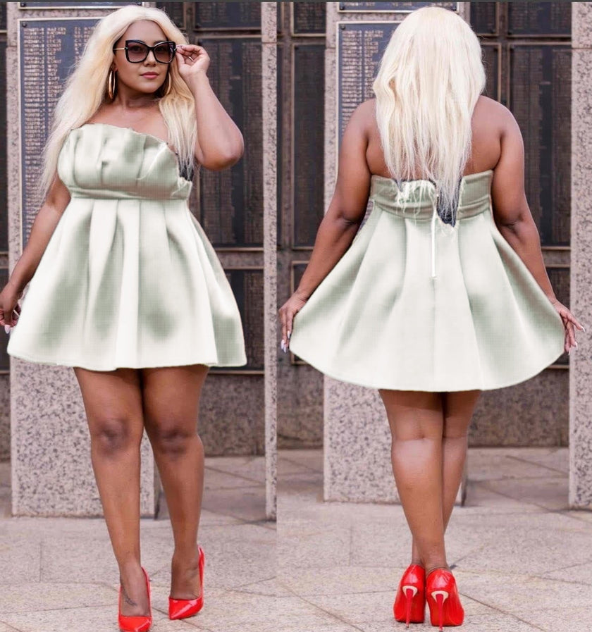 Light green strapless pleated mini dress with fitted bodice, back tie detail