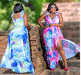 Sky-blue floral maxi dress with ruffle straps and tiered high-low hem