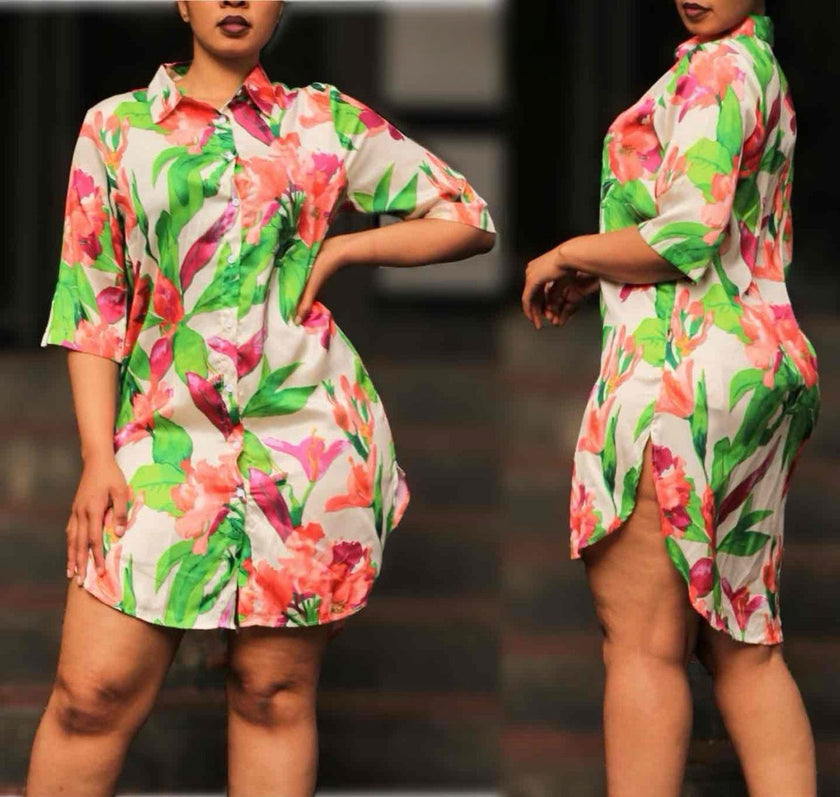 Floral mini shirt dress with short sleeves, collared neckline, and high-low hem.