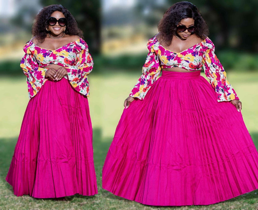 Floral off-shoulder top with flared pleated fuchsia maxi skirt, long sleeves