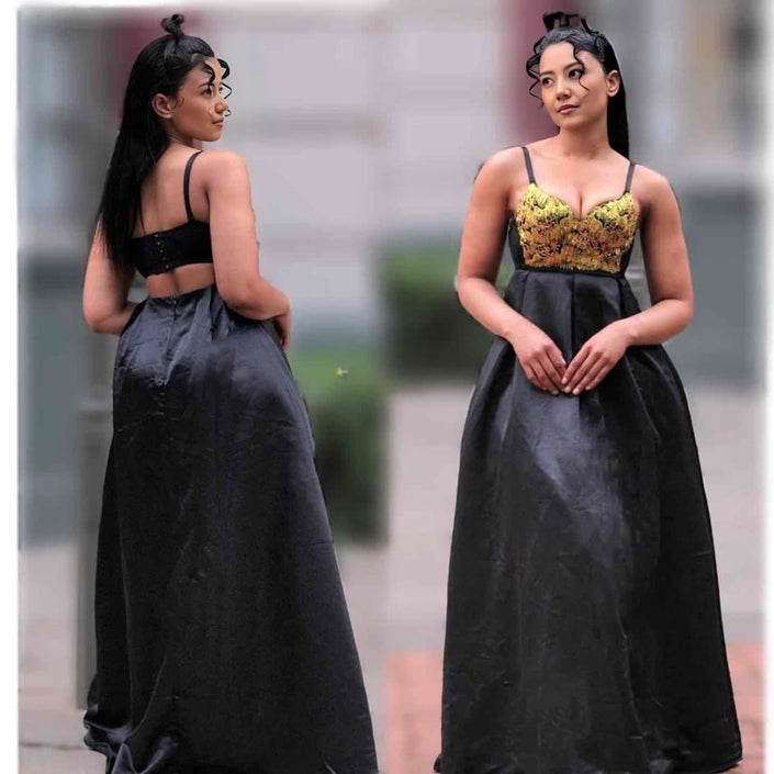Black maxi dress with spaghetti straps and corset-style embellished bodice, full skirt