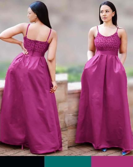 Purple maxi dress with thin straps, patterned bodice, and flowing full skirt