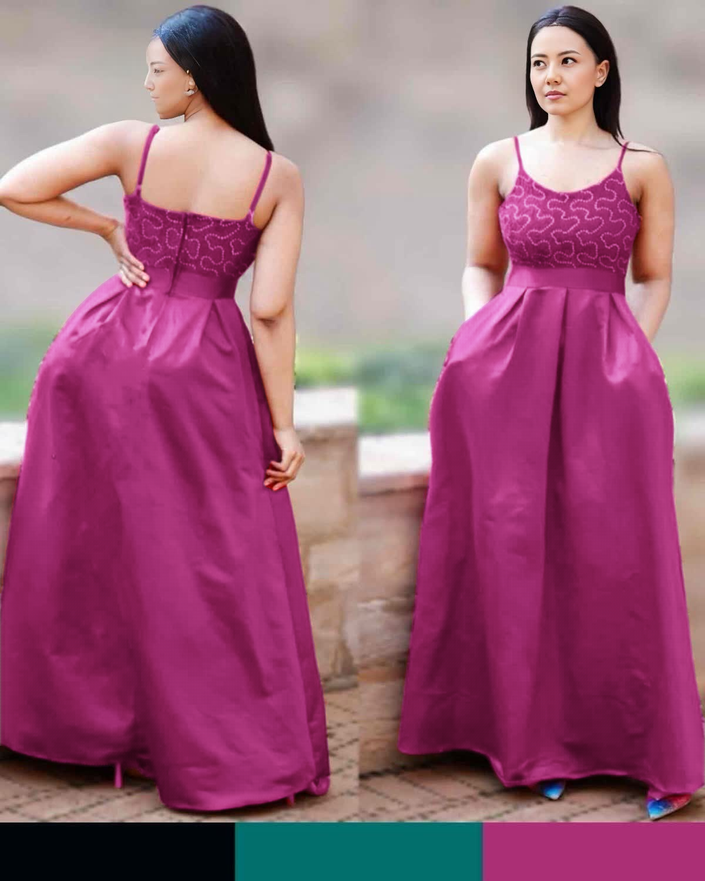 Purple maxi dress with thin straps, patterned bodice, and flowing full skirt