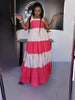 Layered two-tone maxi dress with tiered skirt, pink top and white/rose middle layers.