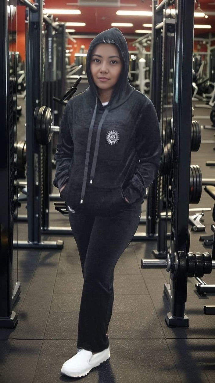 Dark zip-up hoodie and jogger pants set with drawstring hood and side pockets