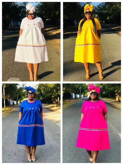 Heritage button-front dress styles in white, yellow, blue, and deep-pink with striped hems
