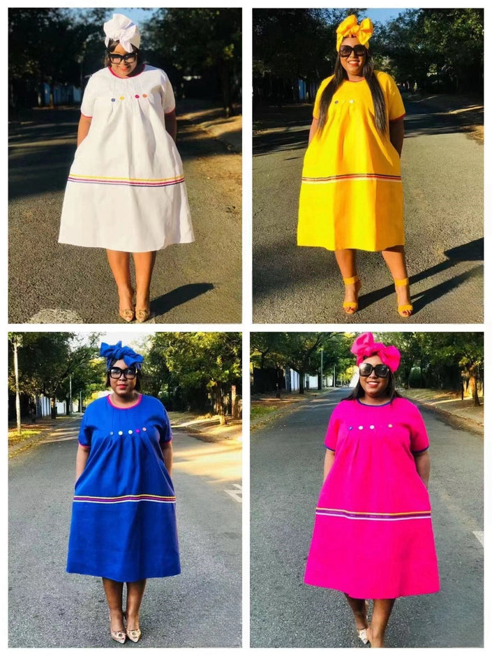 Heritage button-front dress styles in white, yellow, blue, and deep-pink with striped hems