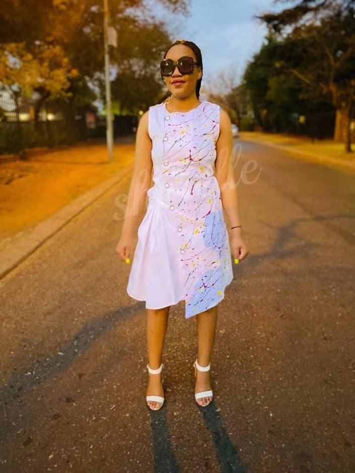 Sleeveless white midi dress with flared skirt and multicolor speckle print
