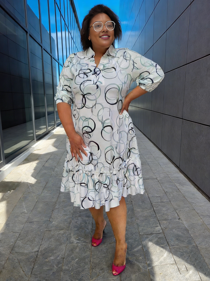 Plus size geometric midi dress with ruffle hem, short sleeves, collared neckline