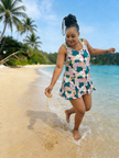 Tropical print swimsuit dress, navy with white palm leaves, ruffled skirt hem