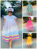 Plus size flared sleeve dress, white with pleated skirt and rainbow striped hem