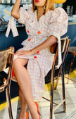 Cream plaid trench coat with puff sleeves, buttoned layered front
