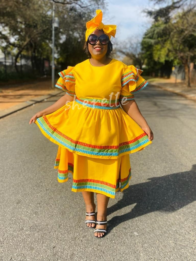 Yellow skirt dress set with rainbow-trim puff sleeves and tiered skirt