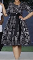 Belted geometric midi dress with puff sleeves, black-and-white print, wide skirt