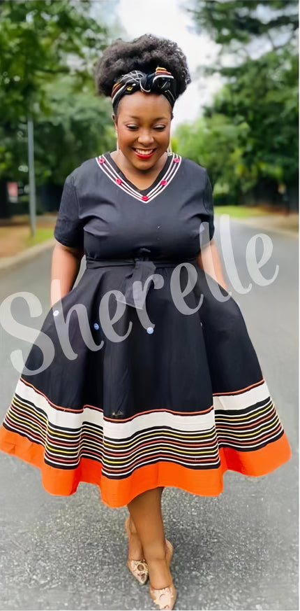 Belted midi dress with V-neck, black fabric, striped hem with orange border