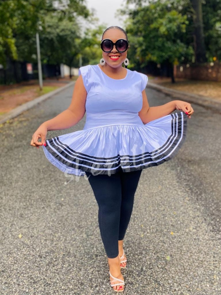 Light blue V-neck flared hem top with striped ruffle hem