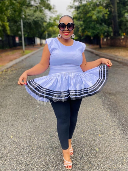 Light blue V-neck flared hem top with striped ruffle hem