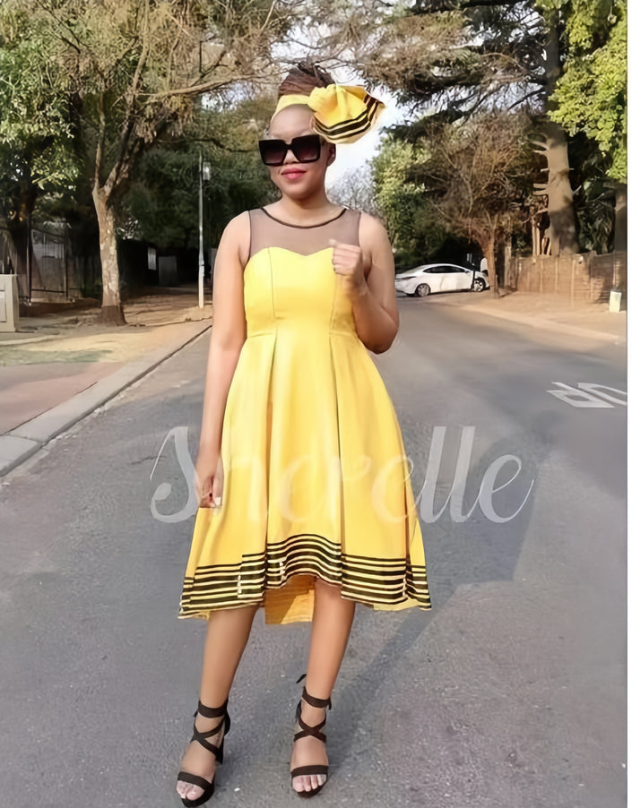 Yellow sleeveless A-line midi dress with striped hem and flared skirt