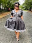 Black puff-sleeve A-line midi dress with embroidered trim and button front