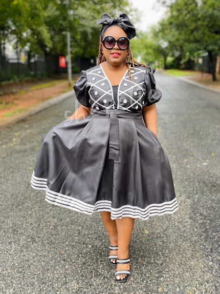 Black puff-sleeve A-line midi dress with embroidered trim and button front