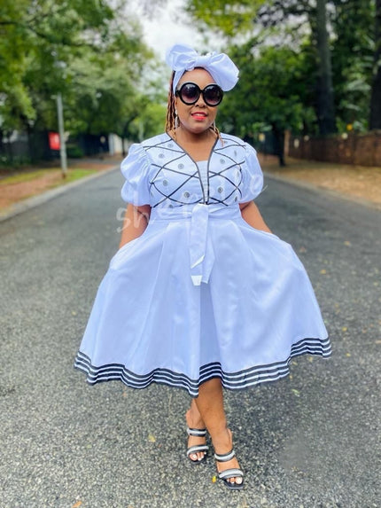 Light blue puff-sleeve A-line midi dress with embroidered trim and button front