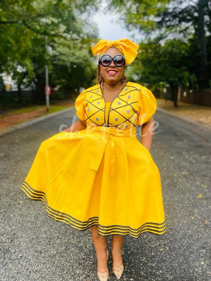 Yellow puff-sleeve A-line midi dress with embroidered trim and button front