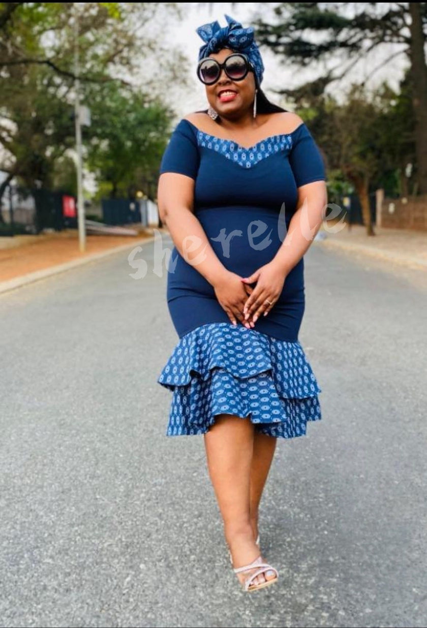 Blue ruffle layered midi dress with patterned bodice and tiered skirt, off-shoulder neckline