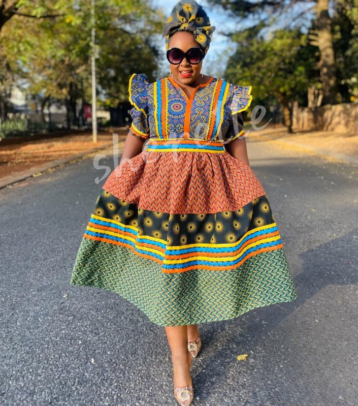Multicolor puff-sleeve midi dress with blue yoke, orange tiered skirt, green hem