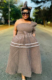 Beige geometric tiered off-shoulder dress with draped sleeves and waist belt
